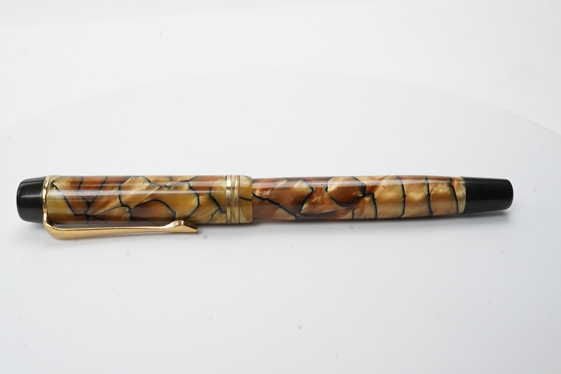 A Montblanc black and pearl fountain pen marked No.322 button filler